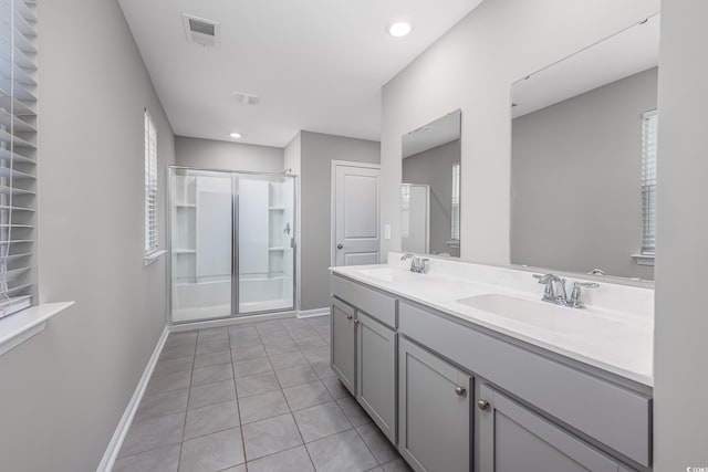 131 Marauder Dr, Longs, SC 29568 - bathroom featuring a stall shower, double vanity, tile patterned flooring, and recessed lighting