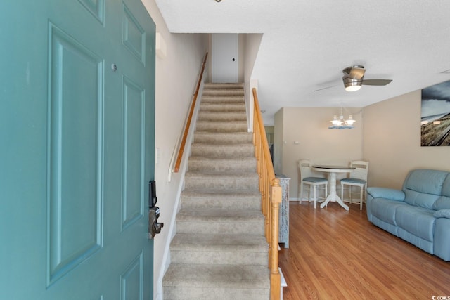 1011 Hunter Ave Unit 1, North Myrtle Beach, SC 29582 - stairway featuring wood finished floors, a ceiling fan, and a textured ceiling