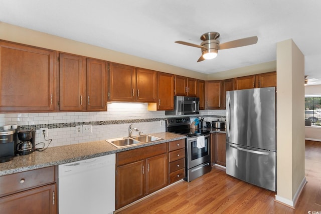 1011 Hunter Ave Unit 1, North Myrtle Beach, SC 29582 - kitchen with appliances with stainless steel finishes, a ceiling fan, light wood-type flooring, and brown cabinetry