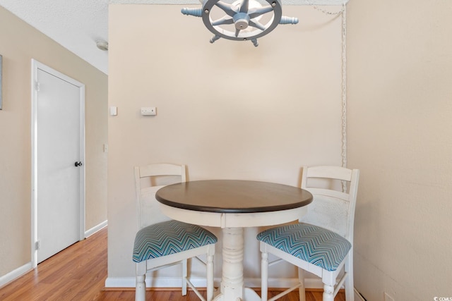 1011 Hunter Ave Unit 1, North Myrtle Beach, SC 29582 - dining room with wood finished floors and baseboards