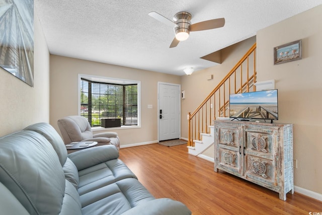 1011 Hunter Ave Unit 1, North Myrtle Beach, SC 29582 - living area with wood finished floors, stairway, a ceiling fan, and a textured ceiling