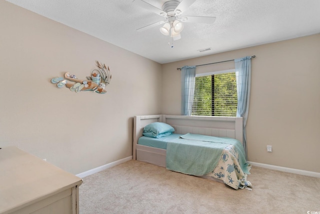 1011 Hunter Ave Unit 1, North Myrtle Beach, SC 29582 - carpeted bedroom with a textured ceiling and a ceiling fan