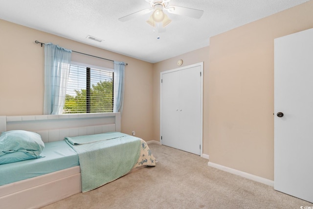 1011 Hunter Ave Unit 1, North Myrtle Beach, SC 29582 - bedroom featuring carpet flooring, a ceiling fan, and a textured ceiling
