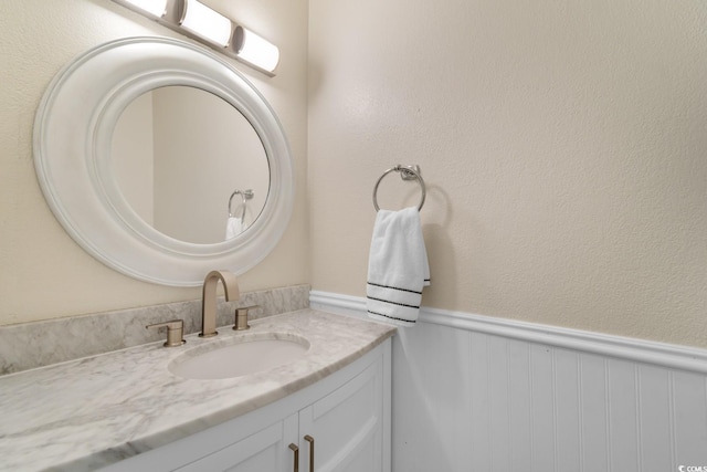 1011 Hunter Ave Unit 1, North Myrtle Beach, SC 29582 - bathroom featuring vanity and wainscoting