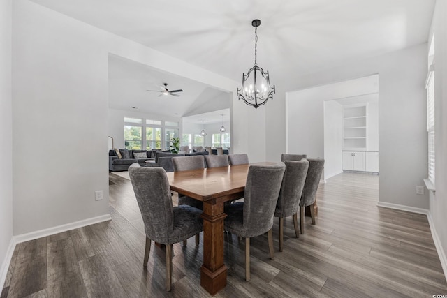 5540 Whitebark Dr, Myrtle Beach, SC 29577 - dining room featuring a chandelier, wood finished floors, a ceiling fan, and vaulted ceiling