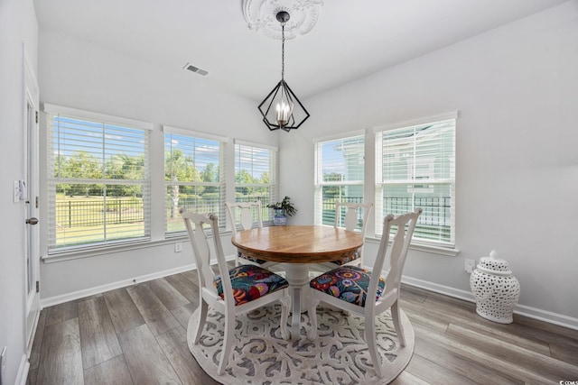 5540 Whitebark Dr, Myrtle Beach, SC 29577 - dining space with a chandelier and wood finished floors