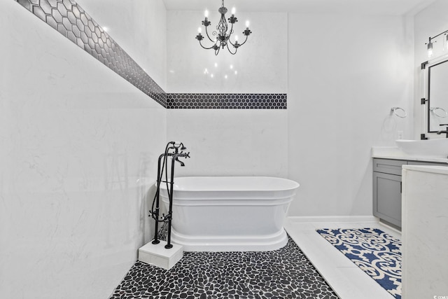 5540 Whitebark Dr, Myrtle Beach, SC 29577 - bathroom featuring vanity, a soaking tub, and a chandelier