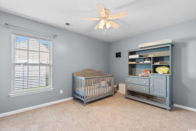 632 Kindred Dr, Myrtle Beach, SC 29588 - carpeted bedroom with a crib and ceiling fan