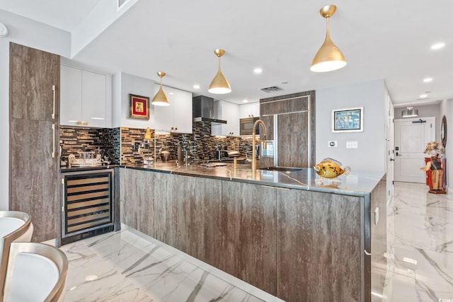 603 S Ocean Blvd Unit 1109, North Myrtle Beach, SC 29582 - kitchen featuring light marble finish floors, beverage cooler, decorative backsplash, and recessed lighting