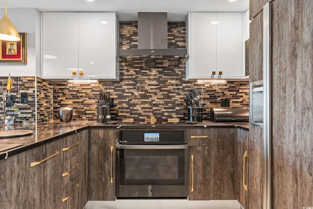 603 S Ocean Blvd Unit 1109, North Myrtle Beach, SC 29582 - kitchen with modern cabinets, wall chimney range hood, white cabinets, and tasteful backsplash