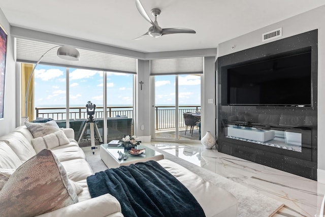 603 S Ocean Blvd Unit 1109, North Myrtle Beach, SC 29582 - living room featuring a ceiling fan and marble tiled floors