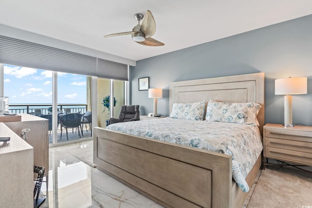 603 S Ocean Blvd Unit 1109, North Myrtle Beach, SC 29582 - bedroom featuring access to exterior, ceiling fan, and light marble finish flooring