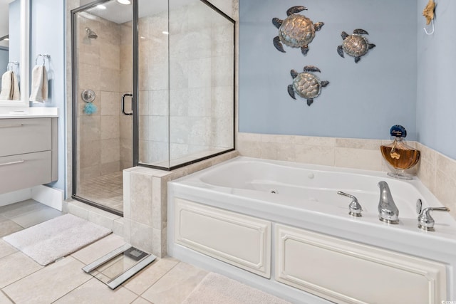 603 S Ocean Blvd Unit 1109, North Myrtle Beach, SC 29582 - bathroom with a stall shower, a jetted tub, tile patterned flooring, and vanity