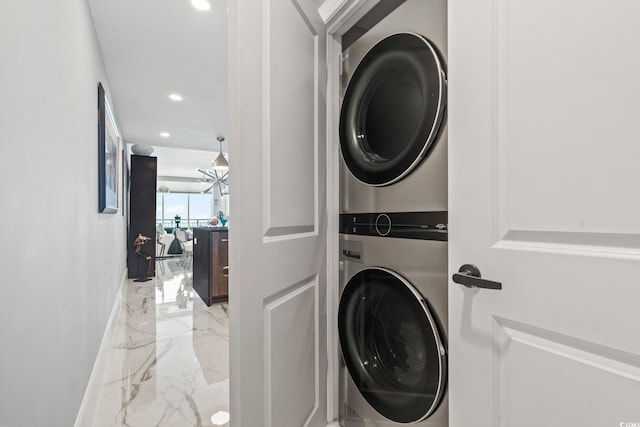 603 S Ocean Blvd Unit 1109, North Myrtle Beach, SC 29582 - laundry room featuring stacked washing machine and dryer, marble tiled floors, and recessed lighting
