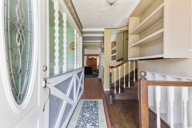 708 Charlotte Rd, Myrtle Beach, SC 29577 - entryway featuring wood-type flooring, stairs, and a textured ceiling