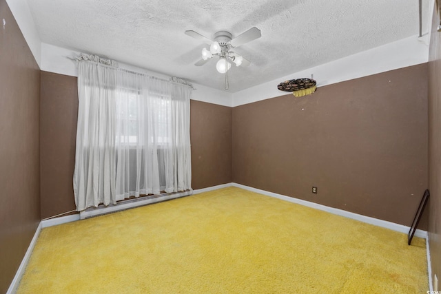 708 Charlotte Rd, Myrtle Beach, SC 29577 - unfurnished room featuring a baseboard heating unit, carpet, ceiling fan, and a textured ceiling
