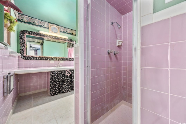 708 Charlotte Rd, Myrtle Beach, SC 29577 - bathroom with tile walls, a stall shower, tile patterned floors, and vanity