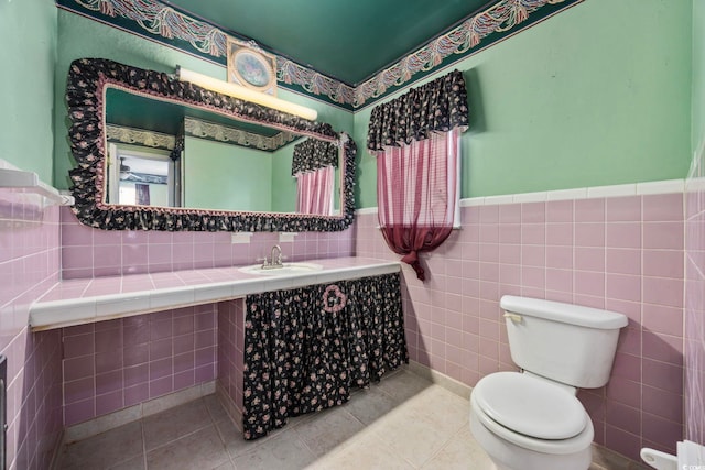 708 Charlotte Rd, Myrtle Beach, SC 29577 - bathroom featuring a wainscoted wall and tile patterned flooring