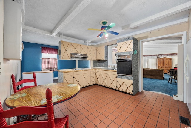 708 Charlotte Rd, Myrtle Beach, SC 29577 - kitchen featuring ceiling fan, light countertops, a textured ceiling, tasteful backsplash, and cream cabinets