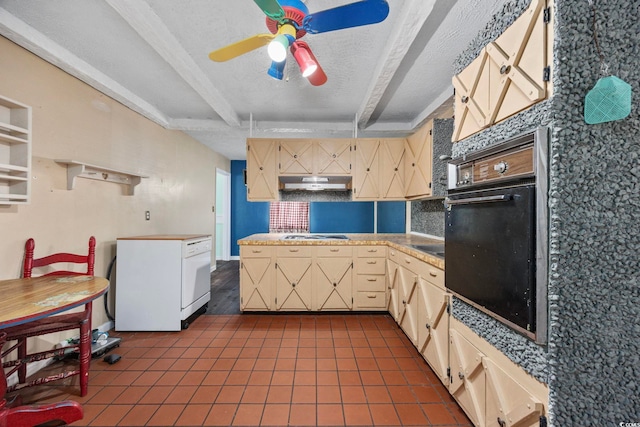 708 Charlotte Rd, Myrtle Beach, SC 29577 - kitchen with cream cabinets, a ceiling fan, dark tile patterned flooring, oven, and beamed ceiling