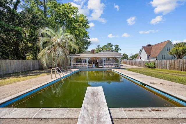 708 Charlotte Rd, Myrtle Beach, SC 29577 - view of pool featuring a diving board, a fenced backyard, and a patio