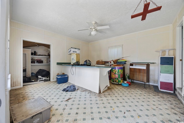 708 Charlotte Rd, Myrtle Beach, SC 29577 - kitchen with ceiling fan, a textured ceiling, and crown molding