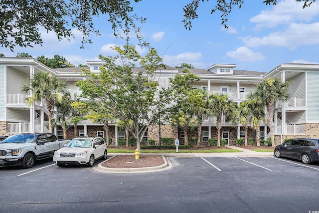 6253 Catalina Dr Unit 1113, North Myrtle Beach, SC 29582 - view of property featuring uncovered parking