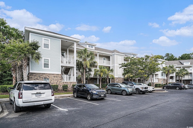 6253 Catalina Dr Unit 1113, North Myrtle Beach, SC 29582 - view of building exterior featuring uncovered parking