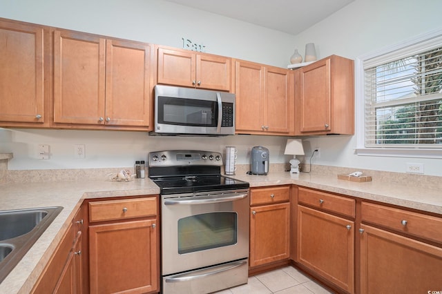6253 Catalina Dr Unit 1113, North Myrtle Beach, SC 29582 - kitchen with appliances with stainless steel finishes, light countertops, and light tile patterned floors