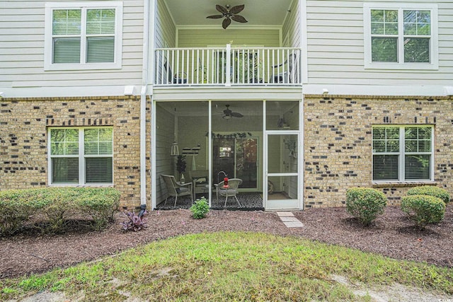 6253 Catalina Dr Unit 1113, North Myrtle Beach, SC 29582 - doorway to property featuring a balcony, a ceiling fan, and brick siding