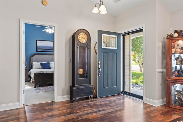 188 Governors Loop, Myrtle Beach, SC 29588 - foyer entrance with dark wood finished floors, a chandelier, and a ceiling fan