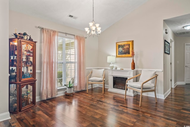 188 Governors Loop, Myrtle Beach, SC 29588 - sitting room with wood finished floors, a chandelier, a glass covered fireplace, and lofted ceiling