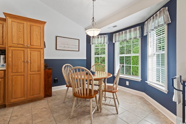 188 Governors Loop, Myrtle Beach, SC 29588 - dining space with vaulted ceiling, plenty of natural light, and light tile patterned floors