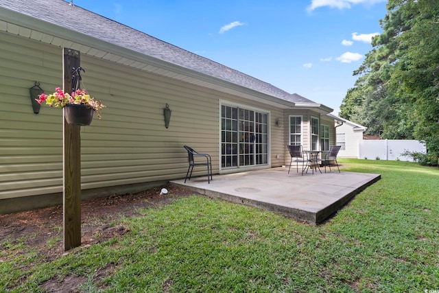 188 Governors Loop, Myrtle Beach, SC 29588 - rear view of property featuring roof with shingles and a patio area