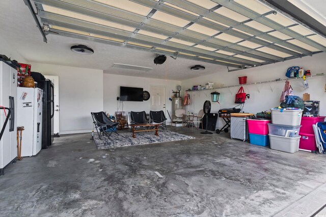 188 Governors Loop, Myrtle Beach, SC 29588 - garage featuring white fridge with ice dispenser and water heater