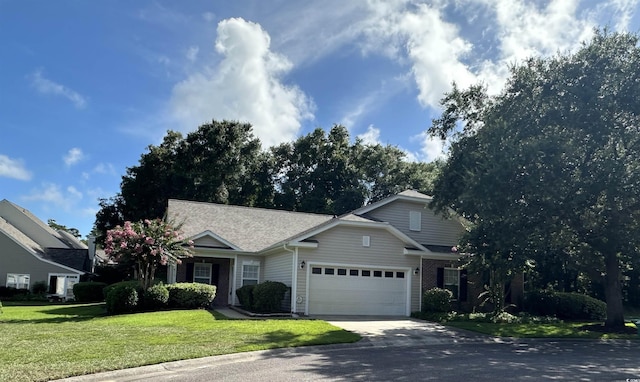 41 Rapture Ct Unit 1, Pawleys Island, SC 29585 - view of front of home with a garage, driveway, a front yard, brick siding, and a shingled roof