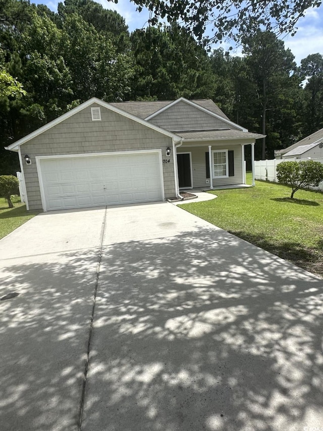 704 Coffee Tree Ct, Myrtle Beach, SC 29579 - view of front of property featuring concrete driveway, an attached garage, a porch, and view of wooded area