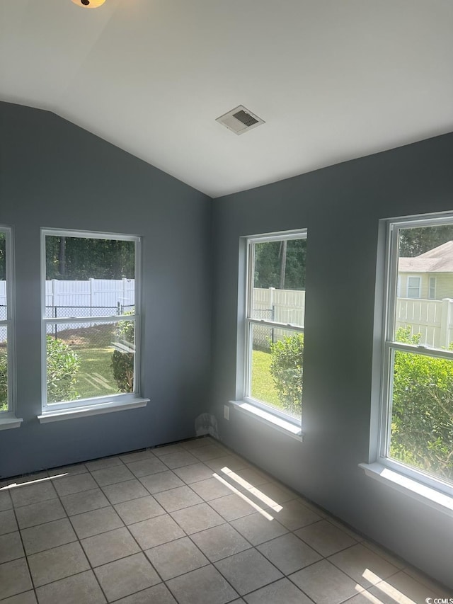 704 Coffee Tree Ct, Myrtle Beach, SC 29579 - empty room featuring tile patterned floors and vaulted ceiling