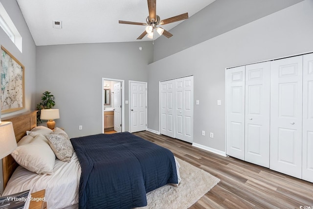 1315 Melanie Ln, Myrtle Beach, SC 29577 - bedroom with two closets, high vaulted ceiling, wood finished floors, ensuite bath, and a ceiling fan