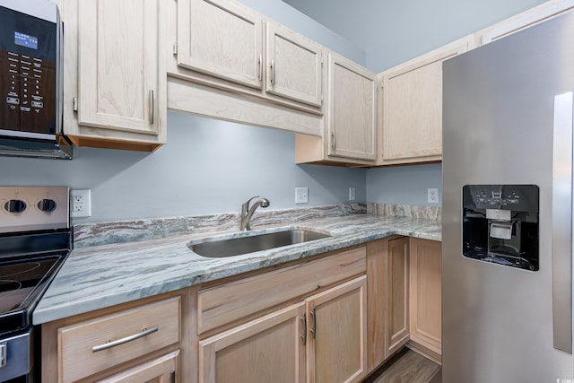 1315 Melanie Ln, Myrtle Beach, SC 29577 - kitchen featuring appliances with stainless steel finishes, light brown cabinetry, light stone counters, and wood finished floors