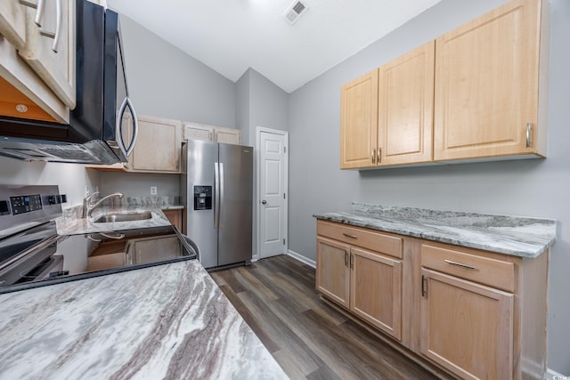 1315 Melanie Ln, Myrtle Beach, SC 29577 - kitchen featuring light brown cabinetry, stainless steel appliances, vaulted ceiling, and dark wood-style flooring