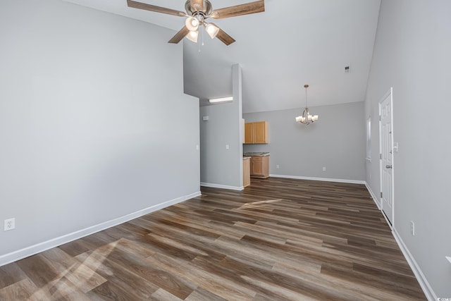 1315 Melanie Ln, Myrtle Beach, SC 29577 - unfurnished living room with a chandelier, high vaulted ceiling, a ceiling fan, and dark wood-style flooring