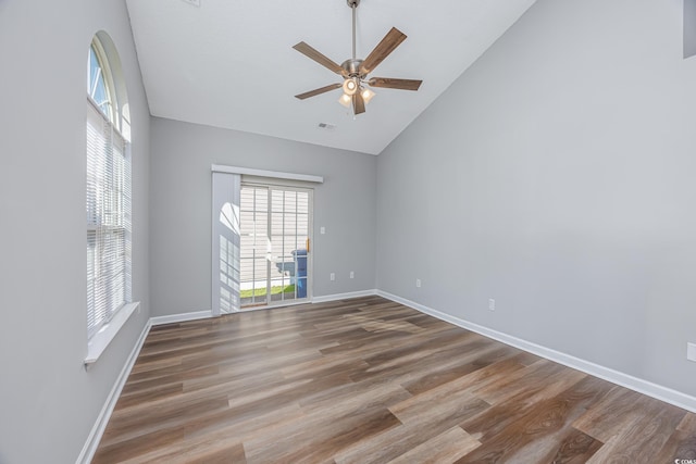 1315 Melanie Ln, Myrtle Beach, SC 29577 - spare room featuring wood finished floors, a ceiling fan, and high vaulted ceiling