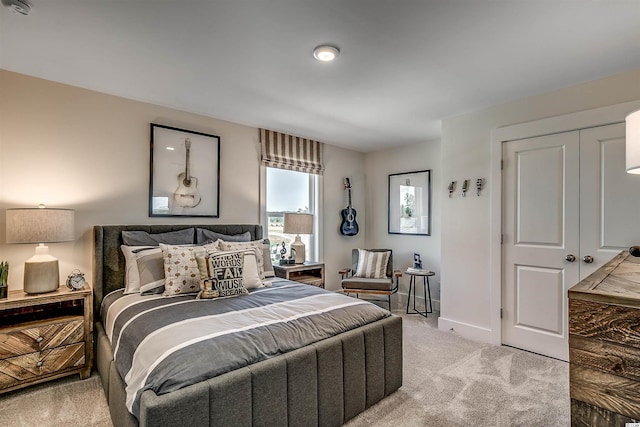 carpeted bedroom featuring a closet