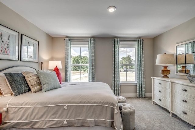 bedroom with light carpet