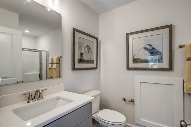 bathroom featuring toilet and vanity