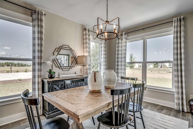 dining room with an inviting chandelier and dark hardwood / wood-style floors