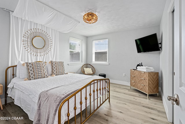 bedroom with light hardwood / wood-style flooring