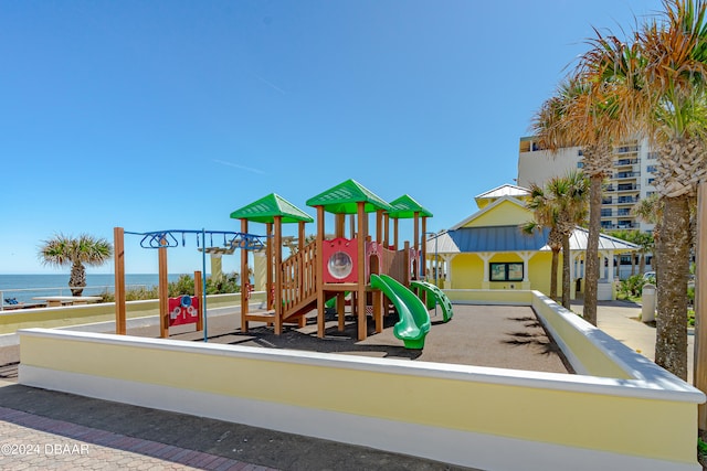 view of play area with a water view