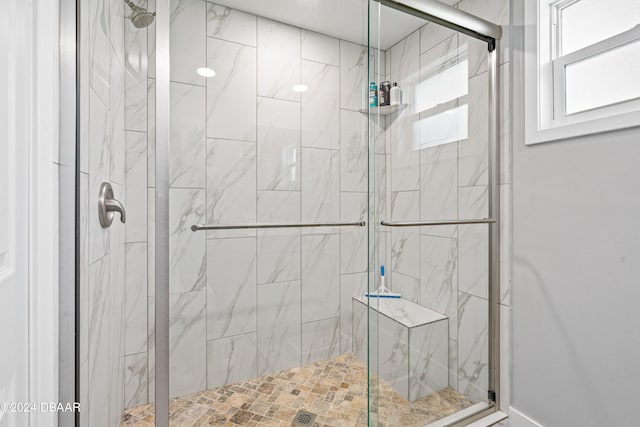 bathroom featuring an enclosed shower